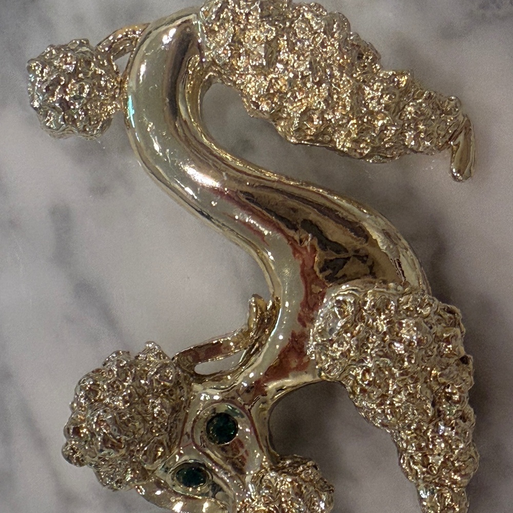 Vintage goldtone Poodle Brooch Pin with green rhinestone eyes